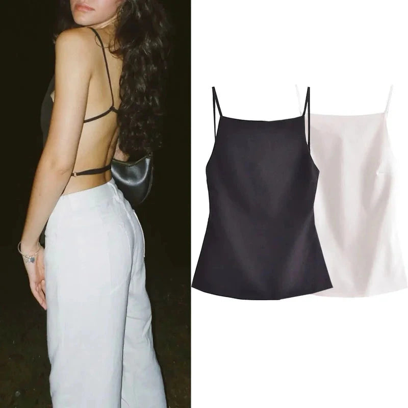 Elegant backless crop top in classic black with delicate straps and lightweight polyester fabric. Ideal for evening wear.