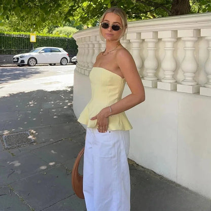 Butter yellow ruffled cami top with a strapless silhouette and lightweight polyester fabric. Ideal for summer outings.