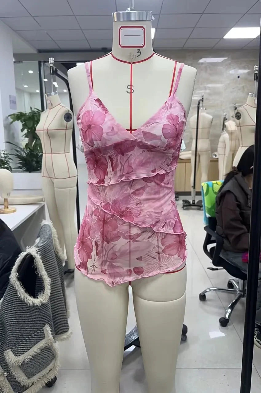 Floral print boho spaghetti strap crop top with lightweight mesh overlay and slight stretch, perfect for summer events.