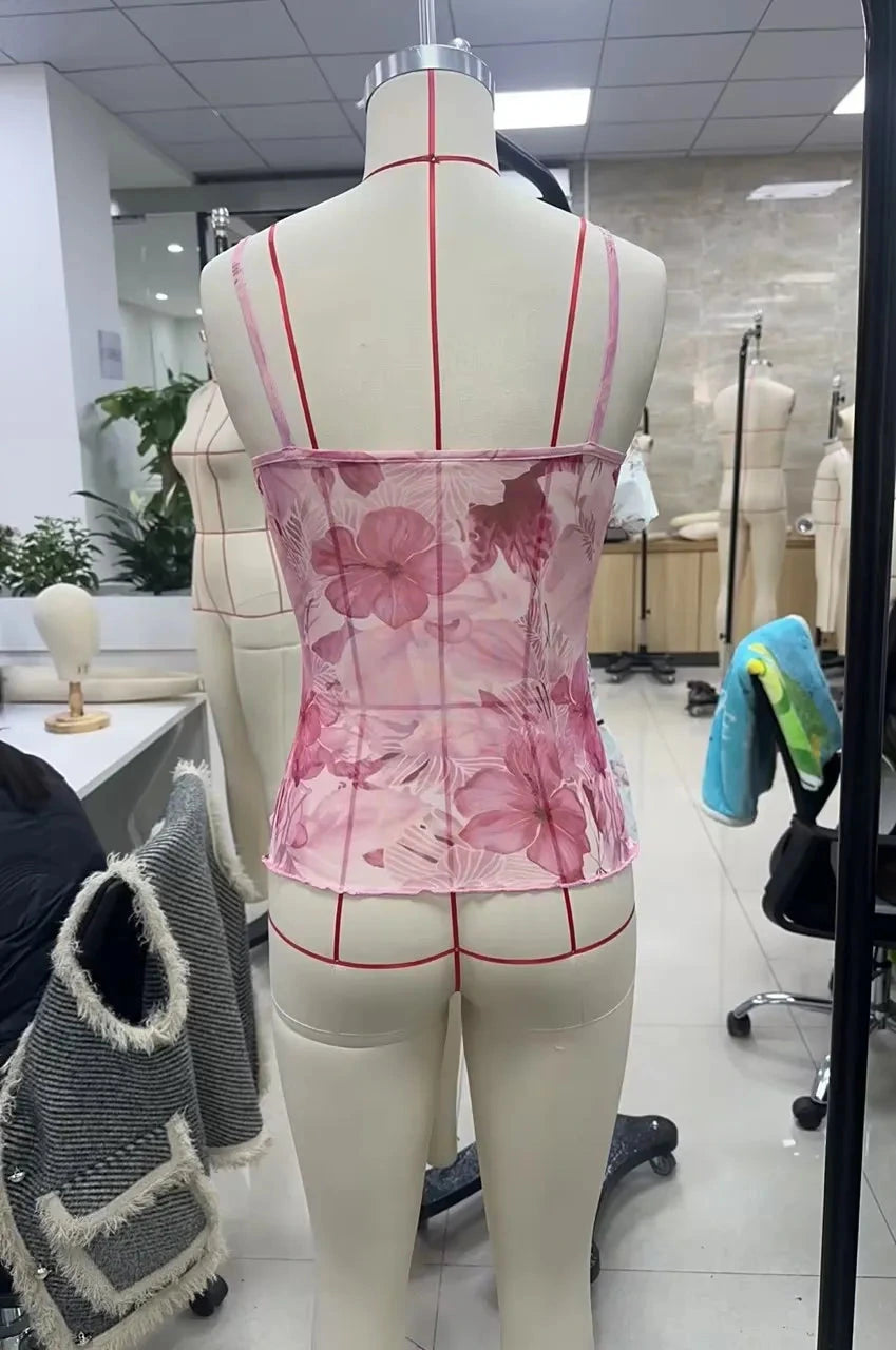Floral print boho spaghetti strap crop top with lightweight mesh overlay and slight stretch, perfect for summer events.