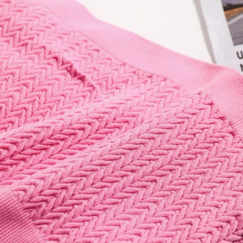 Seamless ribbed bandeau top with a flexible fit, crafted from a soft nylon and spandex blend. Ideal for layering.