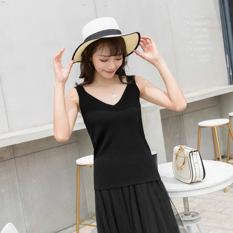 Refined backless padded V-neck tank top made from a soft nylon and viscose blend, ideal for casual wear or layering.