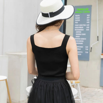 Refined backless padded V-neck tank top made from a soft nylon and viscose blend, ideal for casual or layered looks.