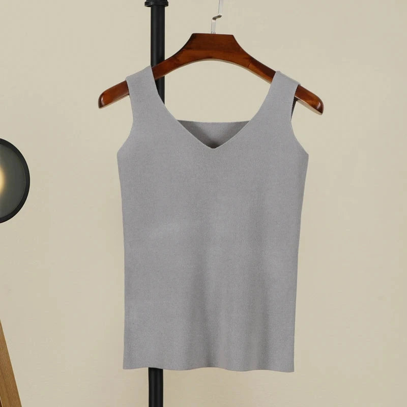 Soft gray backless padded V-neck tank top made from a nylon and viscose blend, featuring medium stretch and regular length.