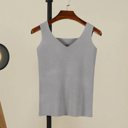 Soft gray backless padded V-neck tank top made from a nylon and viscose blend, featuring medium stretch and regular length.