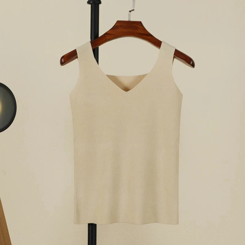 Cream beige backless padded V-neck tank top made from a nylon and viscose blend, featuring medium stretch and regular length.