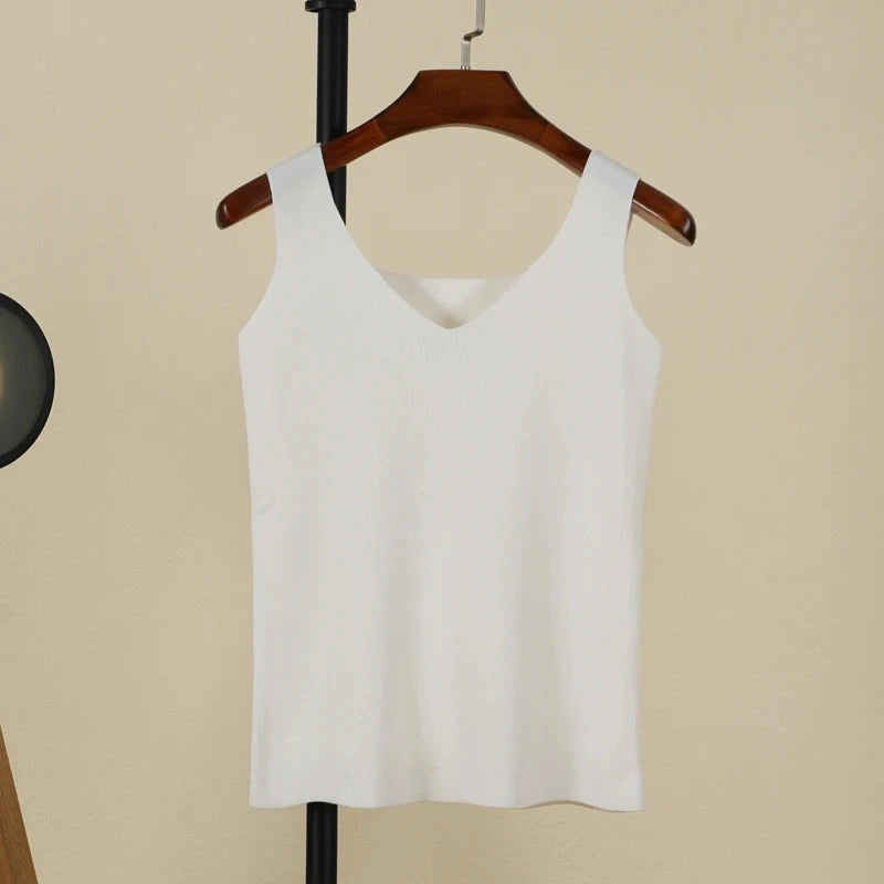 Refined backless padded V-neck tank top in pure white, made from a nylon and viscose blend, regular length.