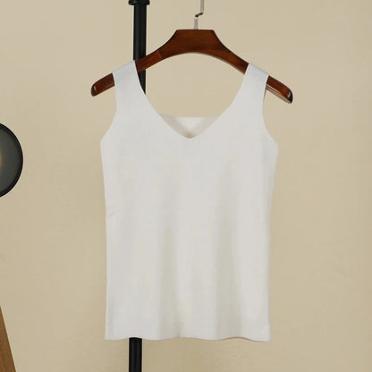 Refined backless padded V-neck tank top in pure white, made from a nylon and viscose blend, regular length.