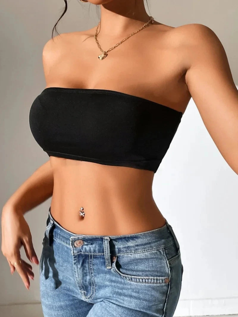 Solid color semi-sheer yoga bandeau crop top made from a polyester and spandex blend with slight stretch.