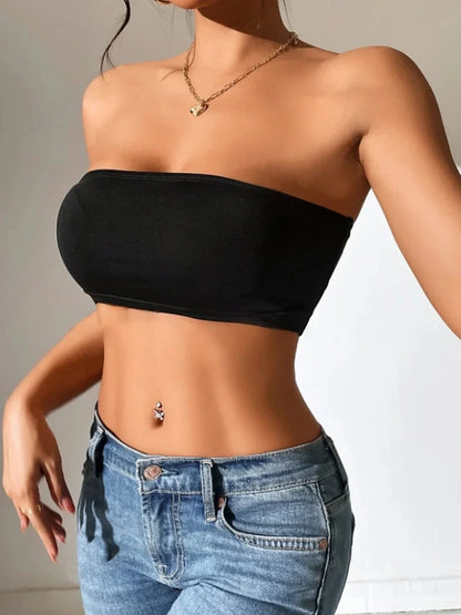 Solid color semi-sheer yoga bandeau crop top made from a polyester and spandex blend with slight stretch.