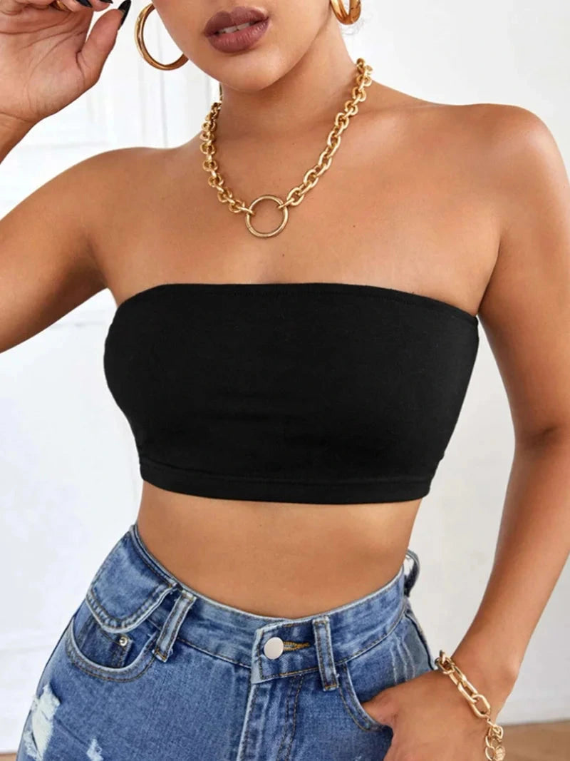 Solid color semi-sheer yoga bandeau crop top made from a polyester and spandex blend with slight stretch.