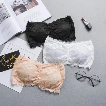 Lace-trimmed bandeau top with invisible support and soft cups, made from high-quality nylon for a seamless fit.