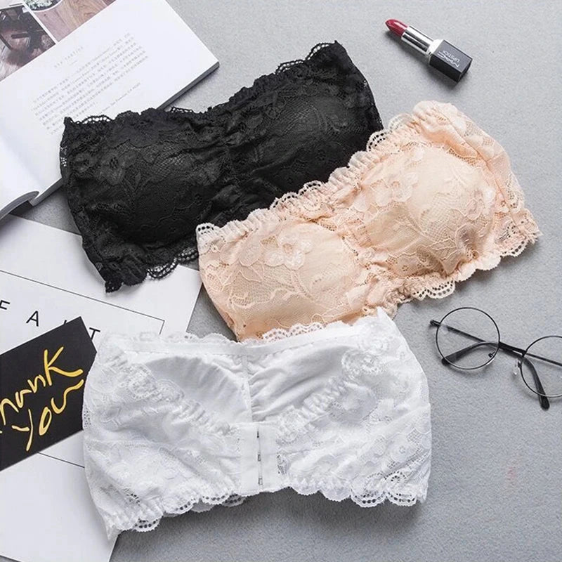 Lace-trimmed bandeau top with invisible support and soft cups, made from high-quality nylon for a seamless fit.