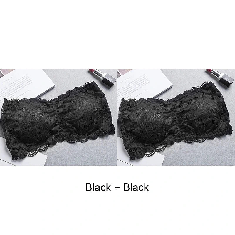 Black lace-trimmed bandeau top with invisible support and soft cups, made from nylon for a seamless fit.