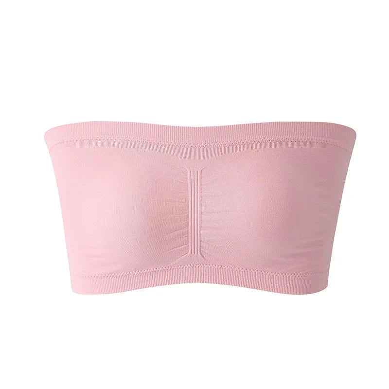 Soft pink seamless plus size strapless bra with removable cushions and stretchy nylon for a supportive fit.