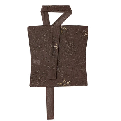 Patterned strapless tulle beaded corset crop top with a backless design and semi-sheer fabric.