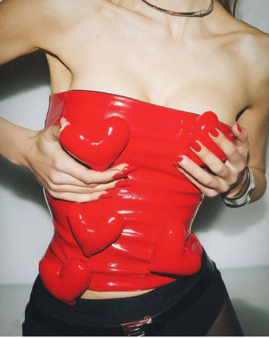3D love heart PU leather tube top with sleeveless design and cropped length, suitable for music festivals and casual wear.
