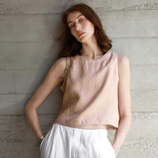 Grey linen top with a loose fit and dropped shoulders.