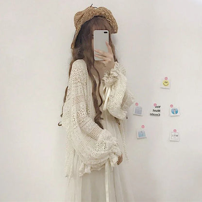 Summer sweet thin sunscreen cardigan female Korean lace-up openwork blouse female holiday beach daily long sleeve blouse